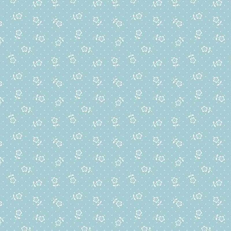 fabric pattern of white flower motifs over a blue background