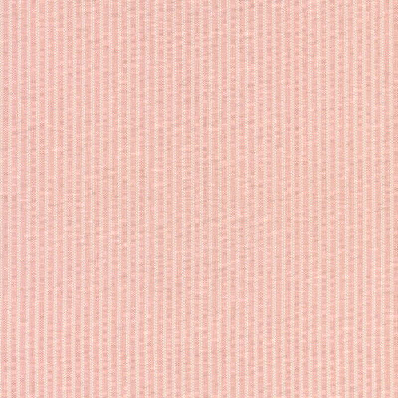 Coral pink fabric with thin rows of stripes made up of tiny white dots.