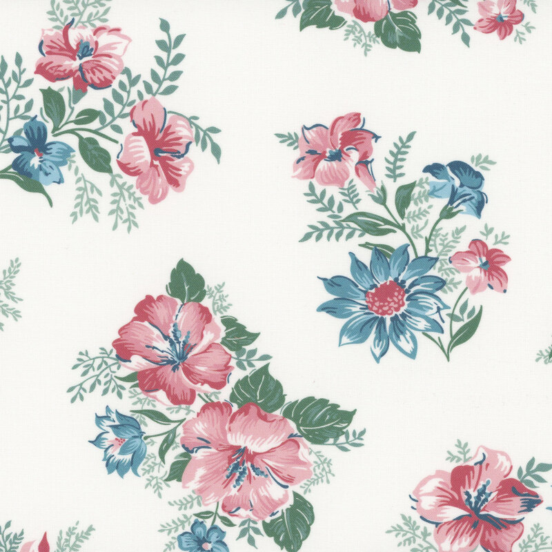 Ivory fabric with a pattern of cool-toned pink and blue flowers in a bouquet with green leaves