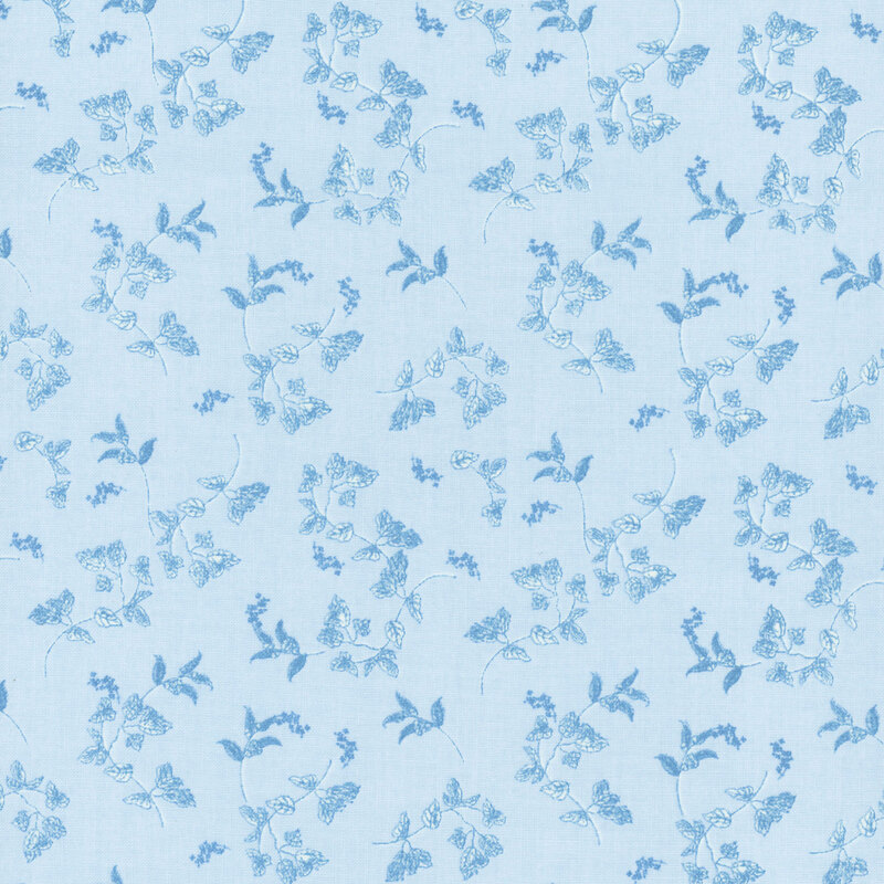 A tonal blue fabric with tossed leaves.