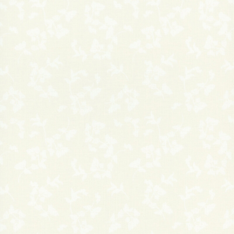 A white on white fabric with tossed leaves.