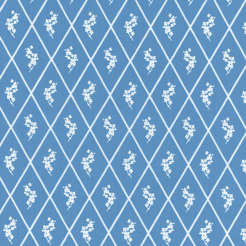 A blue fabric featuring a diamond lattice design, with each diamond enclosing a small white floral motif.
