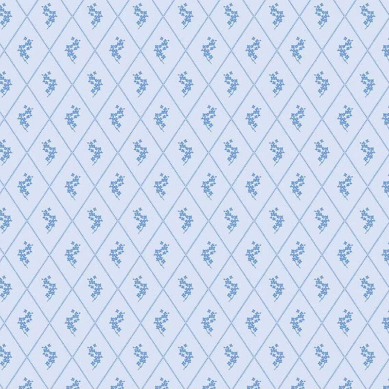 Light blue fabric with a diamond pattern featuring small floral designs in darker blue.