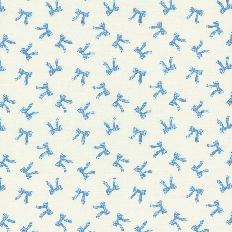 A white fabric with tossed blue bows.