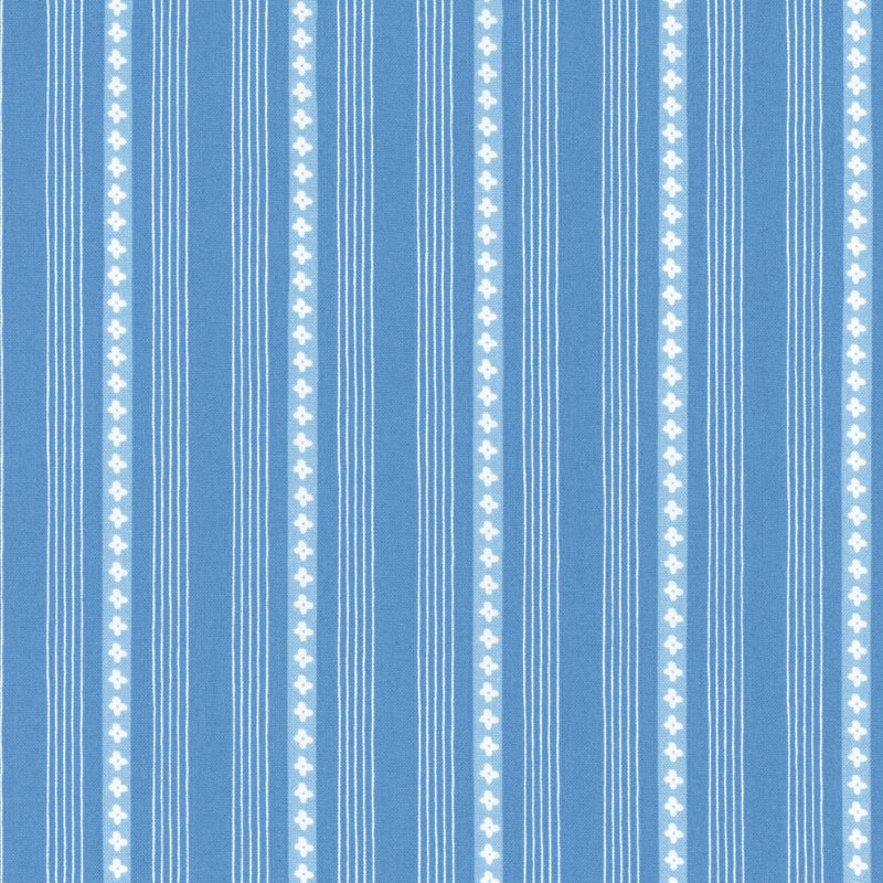 A striped blue and white fabric with small floral designs.