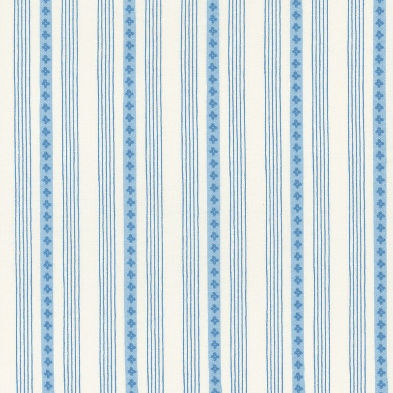 A striped light blue and white fabric with small floral designs.