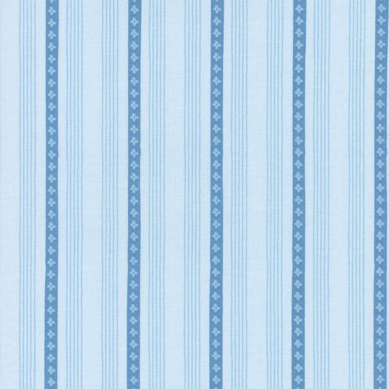 A tonal blue striped fabric with small floral designs.