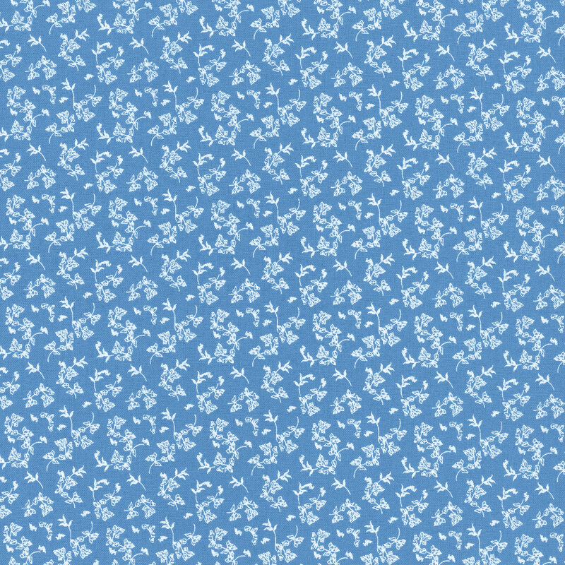 A blue fabric with small tossed white florals.