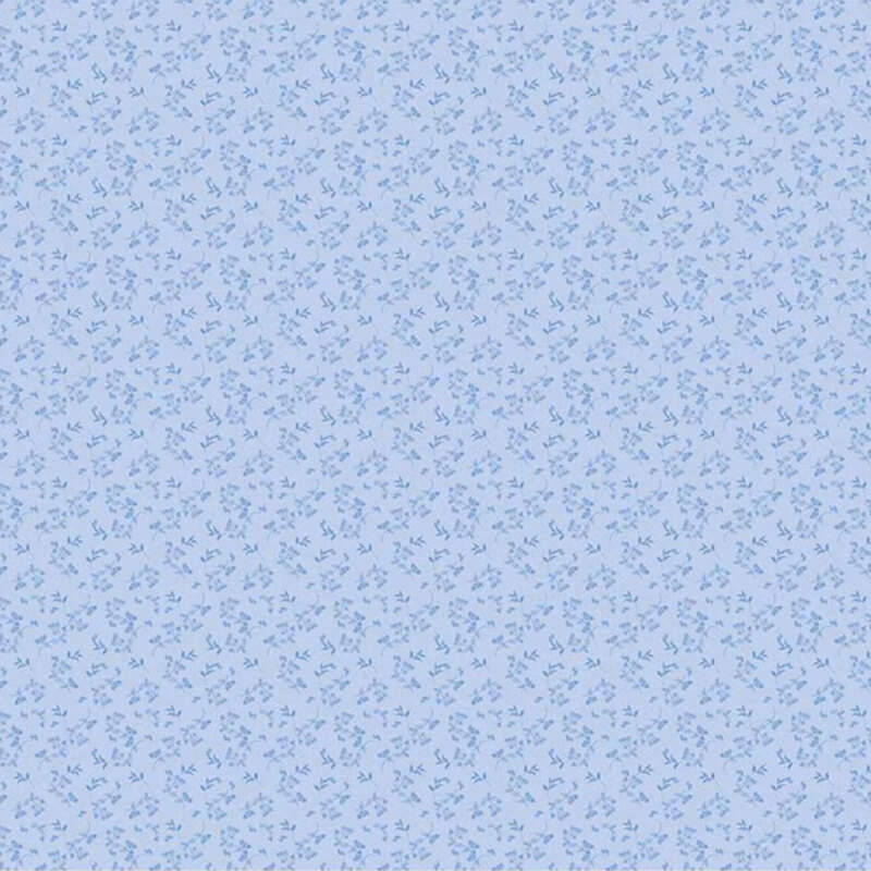 Light blue fabric pattern with small, scattered floral designs in darker blue tones.