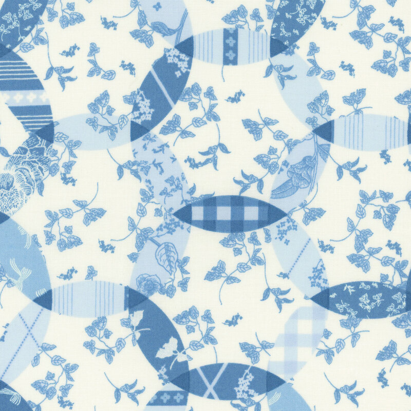 A blue and white fabric with a 'double wedding ring' quilt design. 