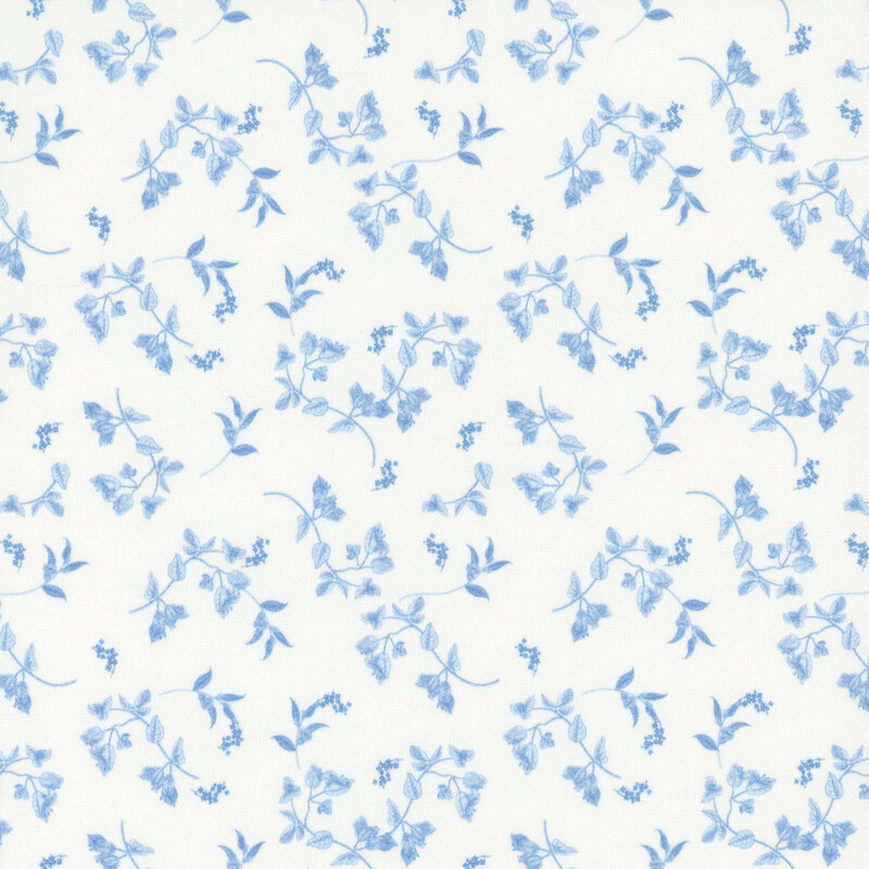 A white fabric with tossed blue leaves.