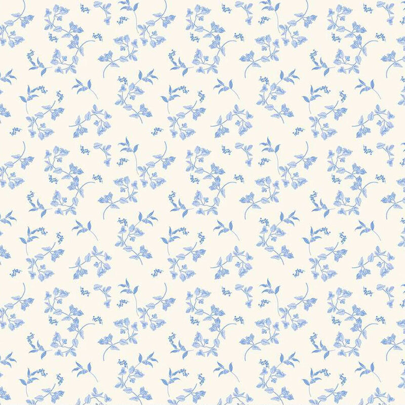 Light cream fabric featuring a repeating pattern of small blue floral designs.