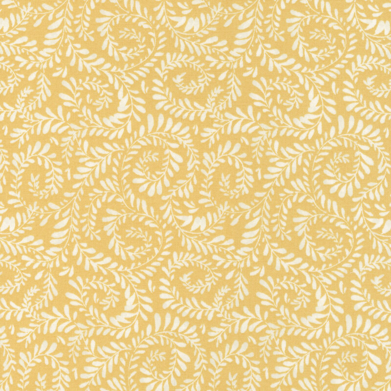 Bright yellow fabric with vines curled in a swirling pattern.