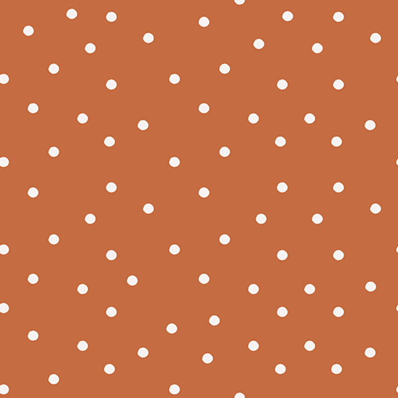 Burnt orange fabric with scattered solid white polka dots.