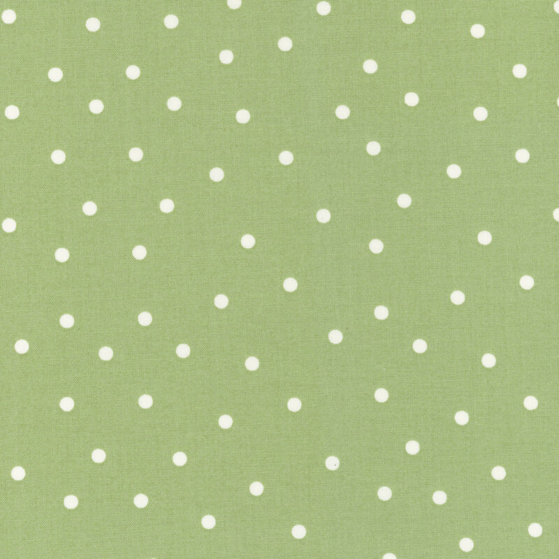 Sage green fabric with scattered solid white polka dots.