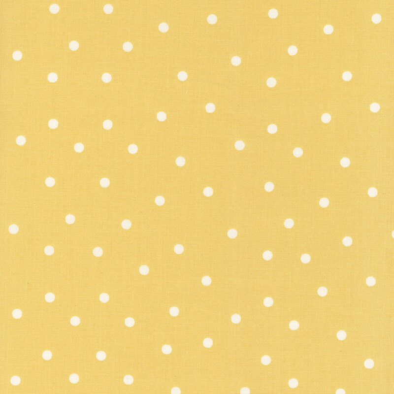 Bright yellow fabric with scattered solid white polka dots.
