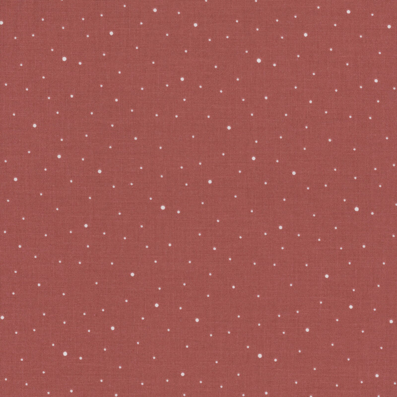 Sienna red fabric with scattered small white dots.