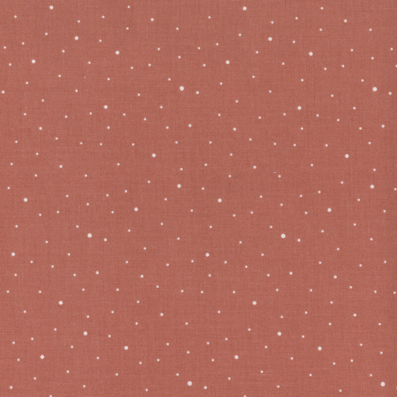 Rosy brown fabric with scattered small white dots.