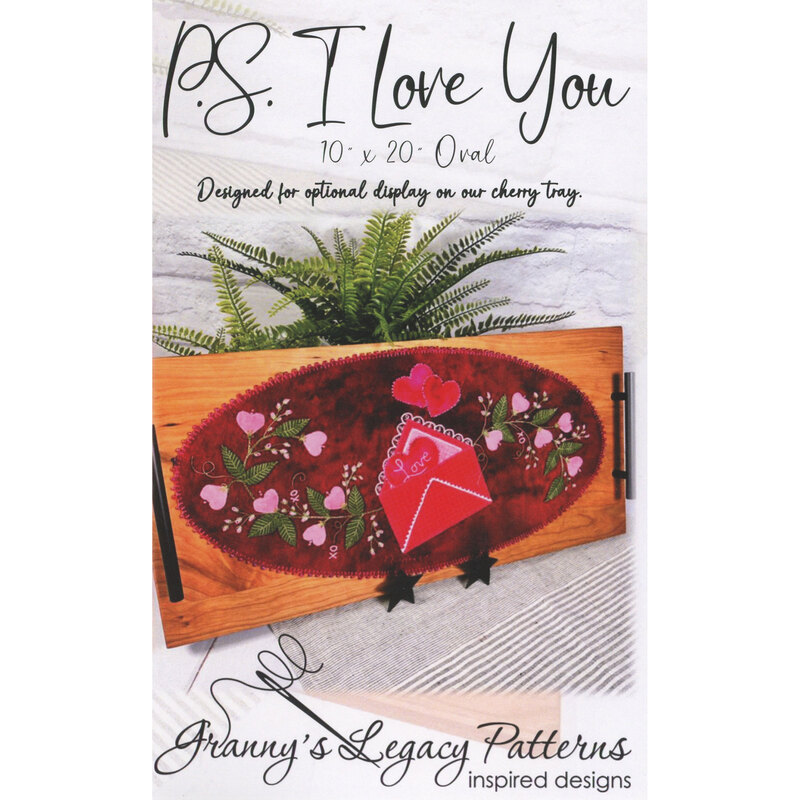 Front cover of the PS I Love You pattern, showing the completed project staged with a houseplant.