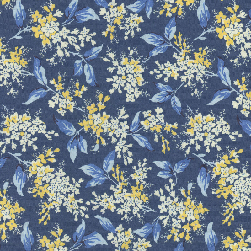 A floral pattern featuring cream and yellow flowers on a blue background.