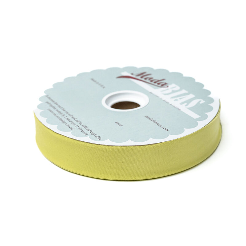 Spool of chartreuse bias tape isolated on a white background