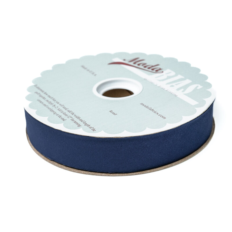 Spool of blue bias tape isolated on a white background