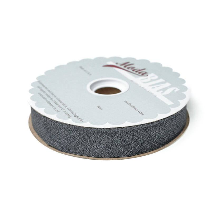 Spool of graphite bias tape isolated on a white background