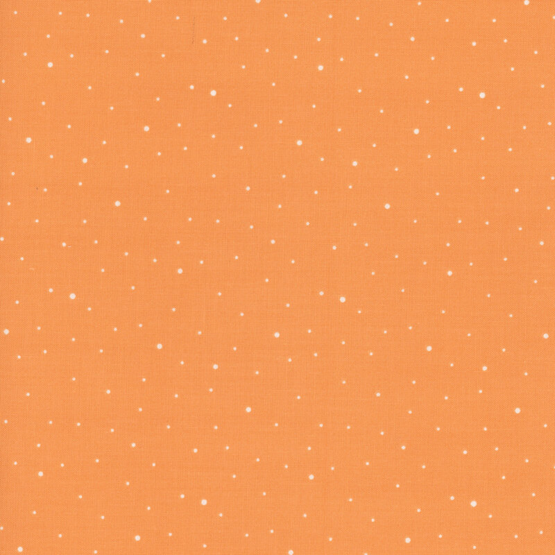 Light orange fabric with scattered small white dots.