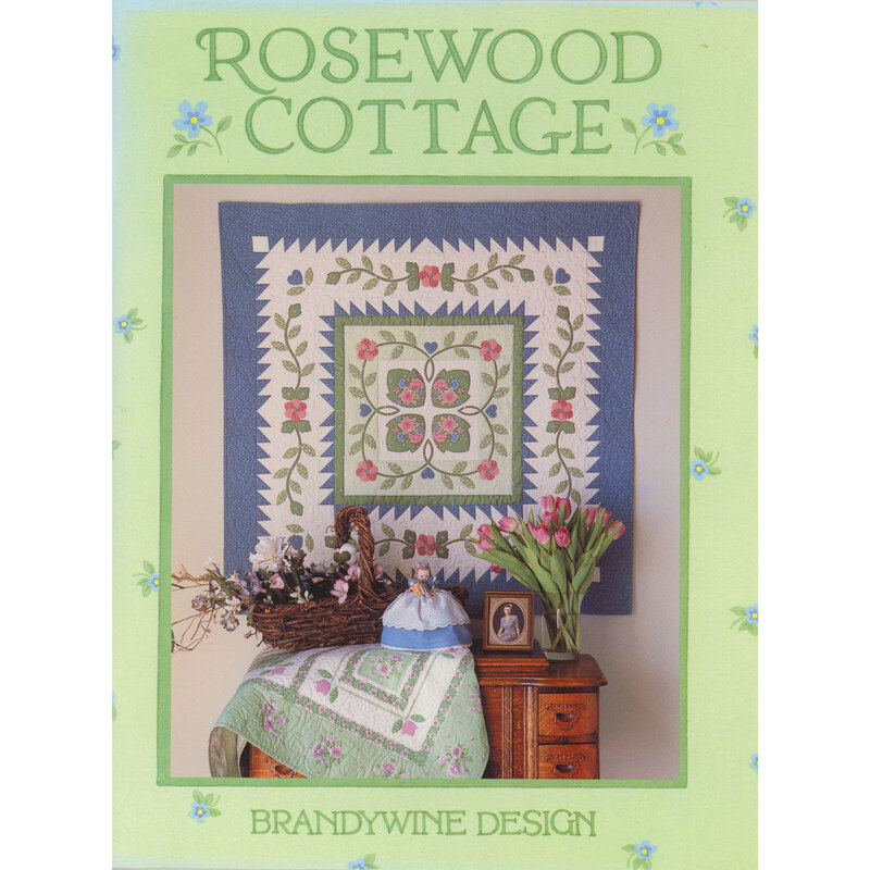 Book cover featuring a floral quilt design, with Rosewood Cottage title and a cozy setting.