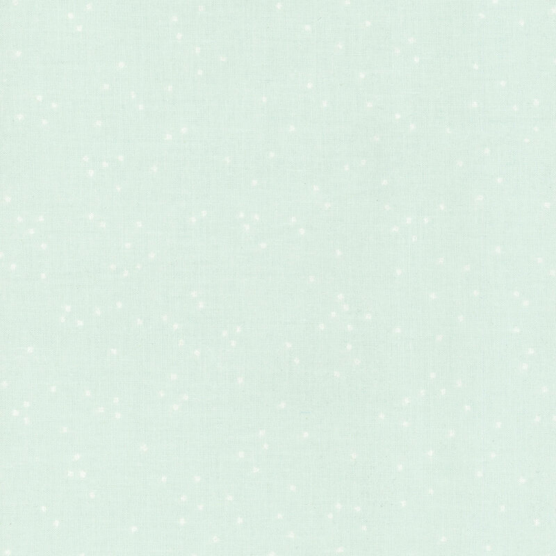 Light mint green fabric with scattered small white dots.