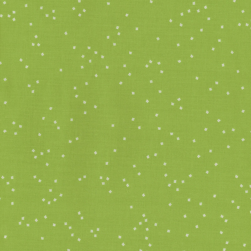 A vibrant green fabric background scattered with small, white, star-like dots.