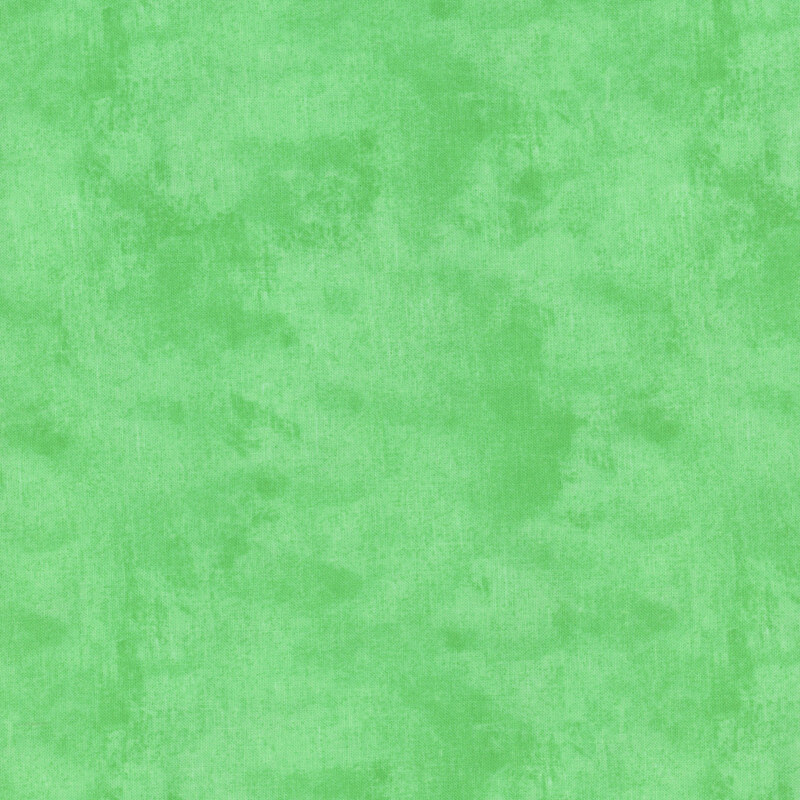 Mottled, textured, and tonal bright kelly green fabric swatch.