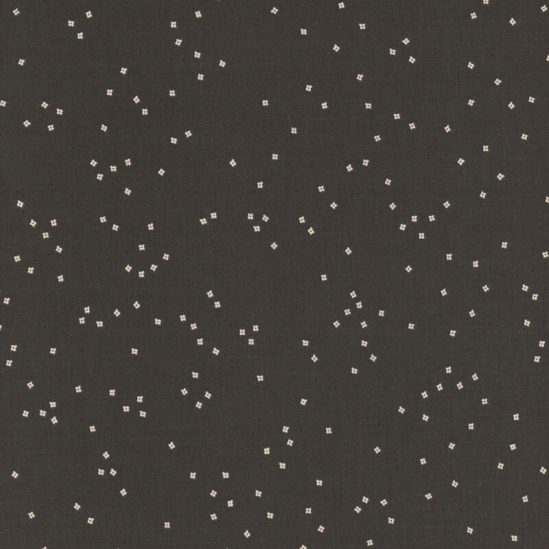 Black fabric with scattered white square and rectangular dots.