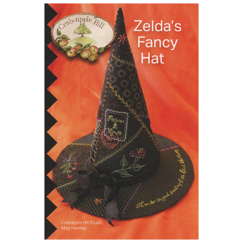 The front of the Zelda's Fancy Hat pattern with the finished project staged on an orange backdrop.