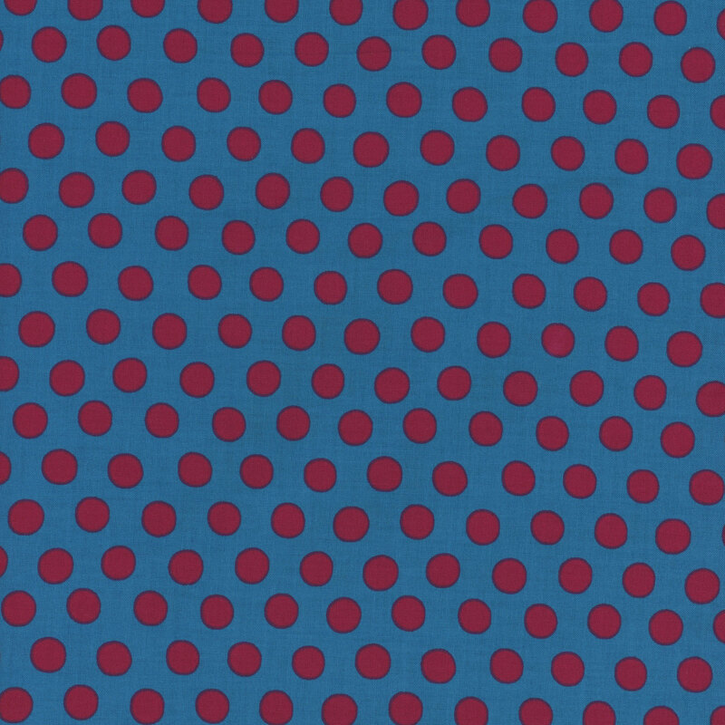 Blue fabric with a repeating pattern of red polka dots.