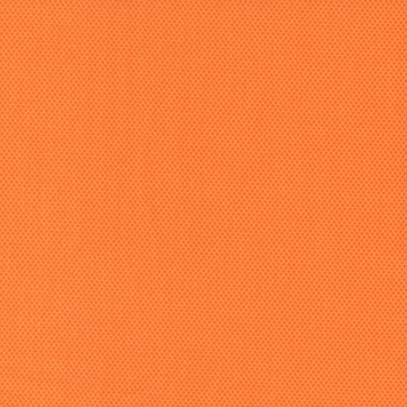 Tangerine orange fabric featuring a dotted halftone tonal print.