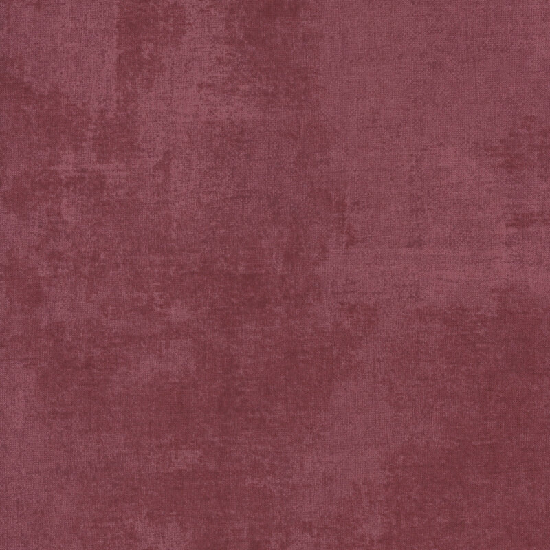 Wine colored fabric featuring dry-brushed texturing