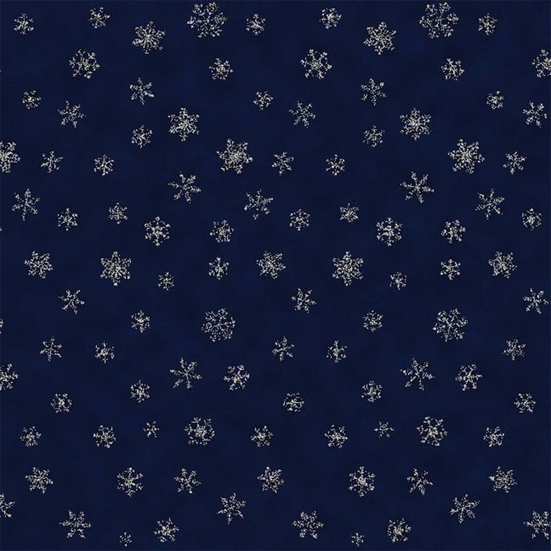 fabric of small white snowflakes on a dark blue background