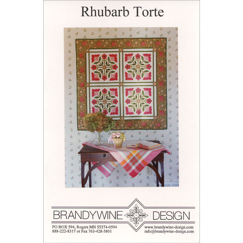 Cover of the Rhubarb Torte quilt pattern, featuring the finished quilt hung on a wall above a small decorated table.