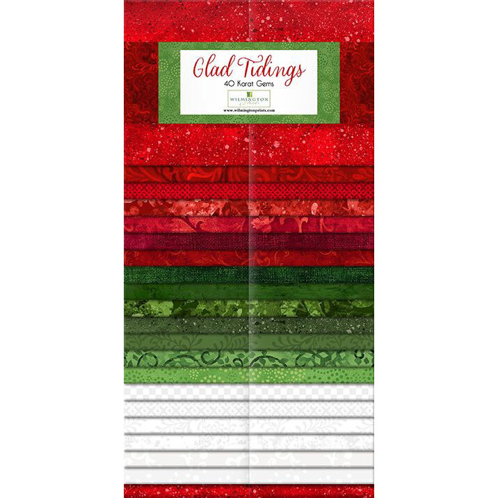 A stack of fabric strips in red, green and white labeled Glad Tidings