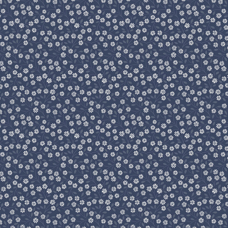 fabric pattern of white daisies all over a deep blue background