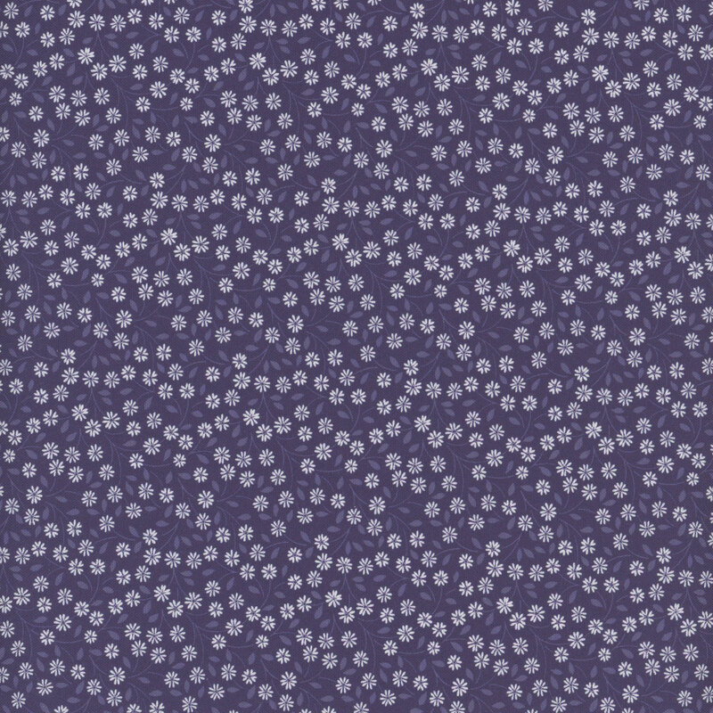 fabric pattern of white daisies scattered on a deep blue background