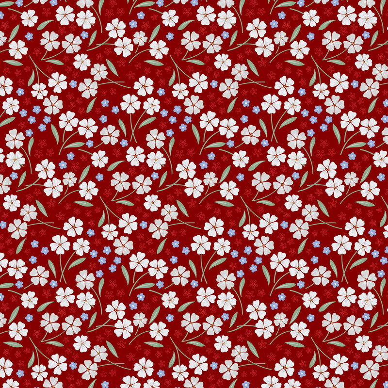 fabric pattern of white and red florals all on a red background