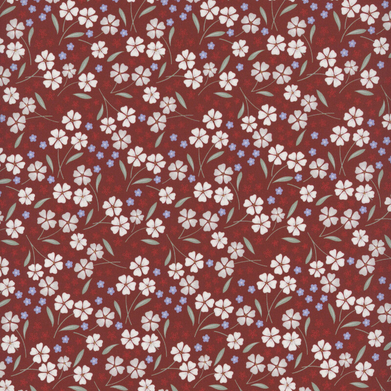 fabric pattern of white and red florals scattered on a red background