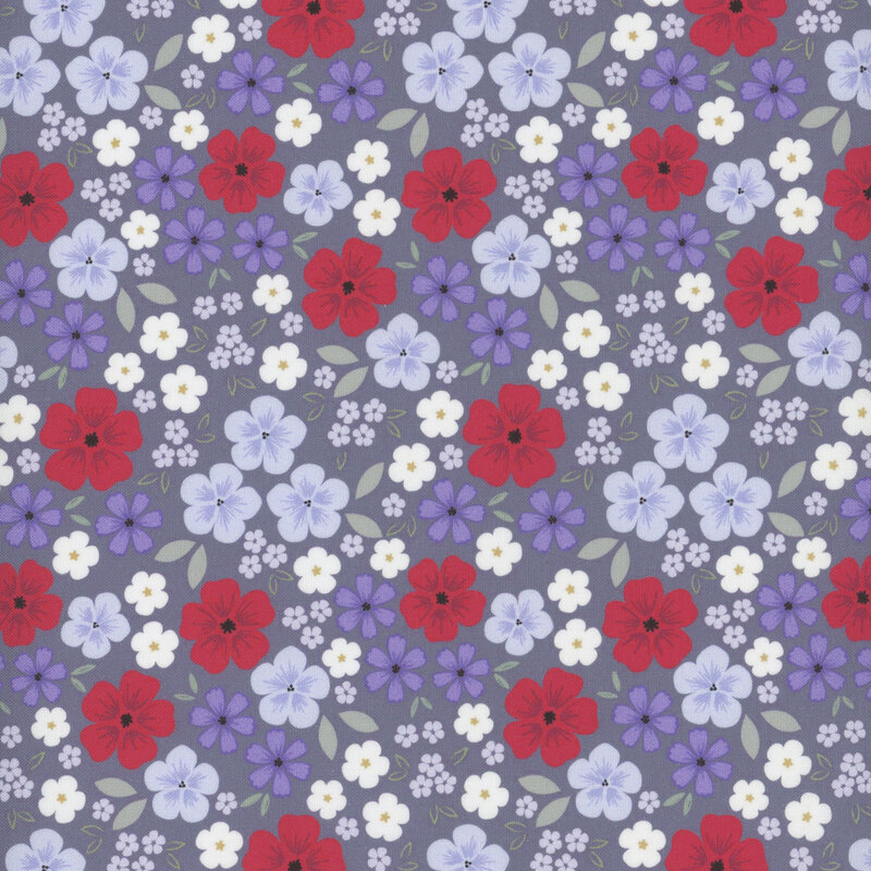 fabric pattern of red, white, and blue flowers scattered on a deep blue background