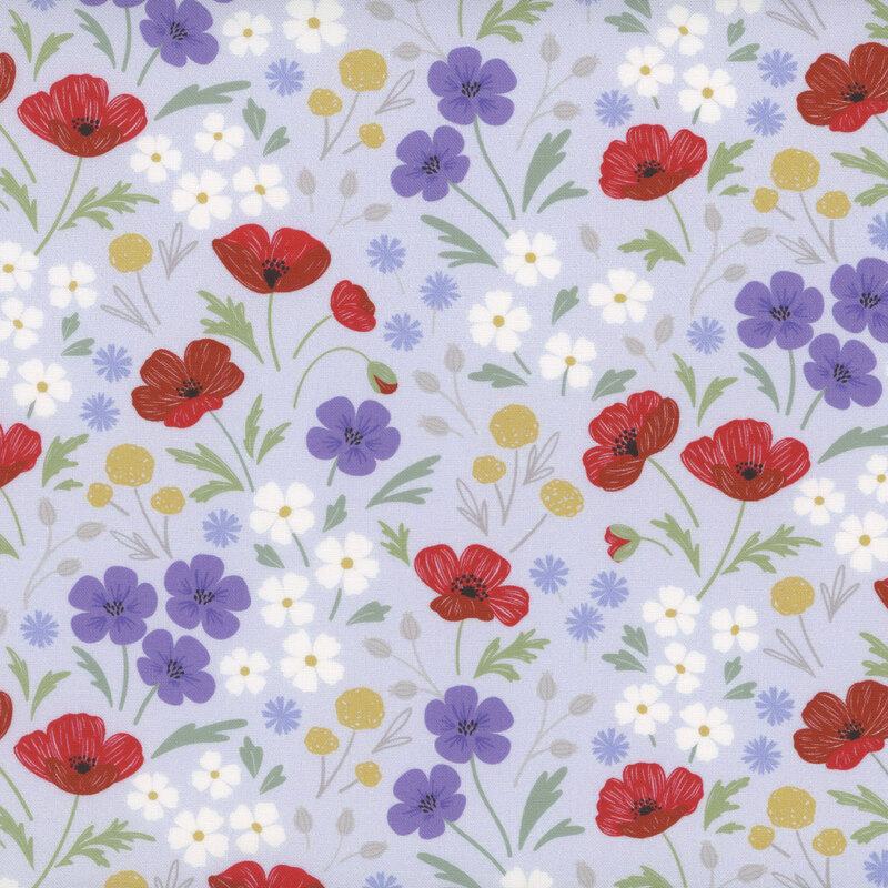 fabric of different flowers red, blue, white, and yellow scattered on a pale blue background