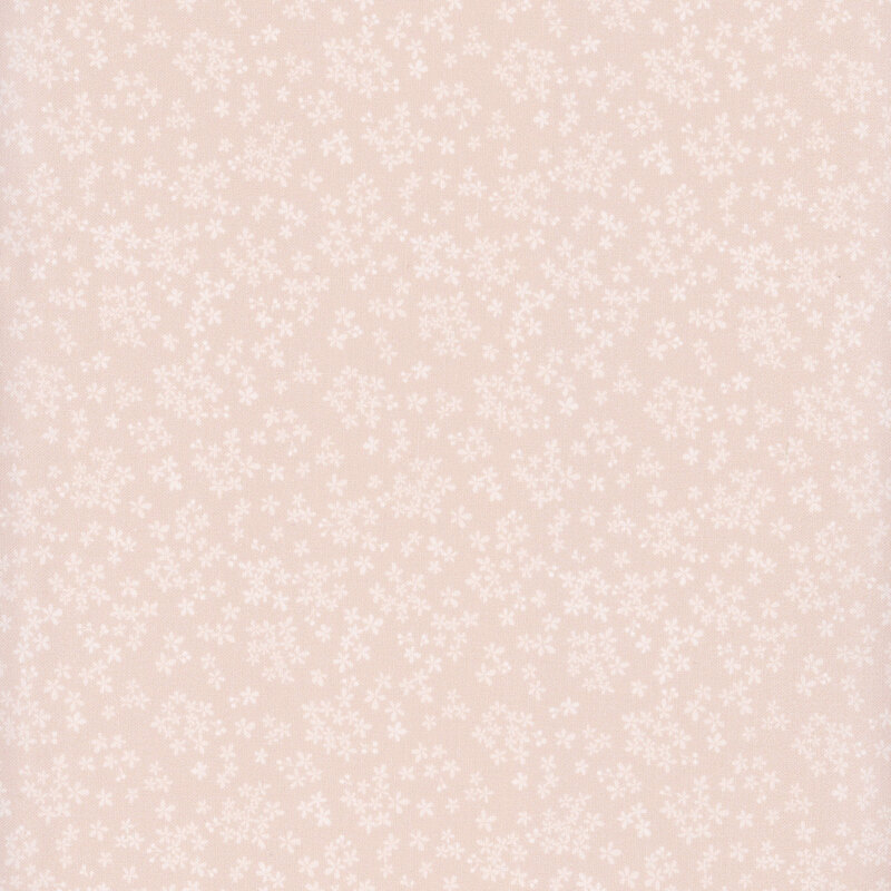 A soft pink fabric adorned with small, scattered white floral patterns.