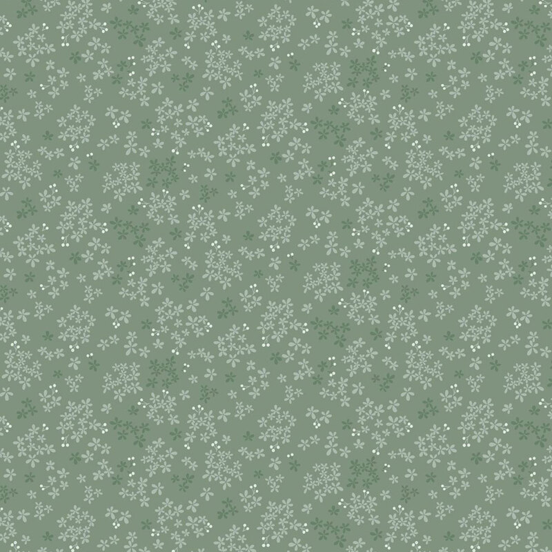 Seamless pattern of small white flowers on a muted green background.