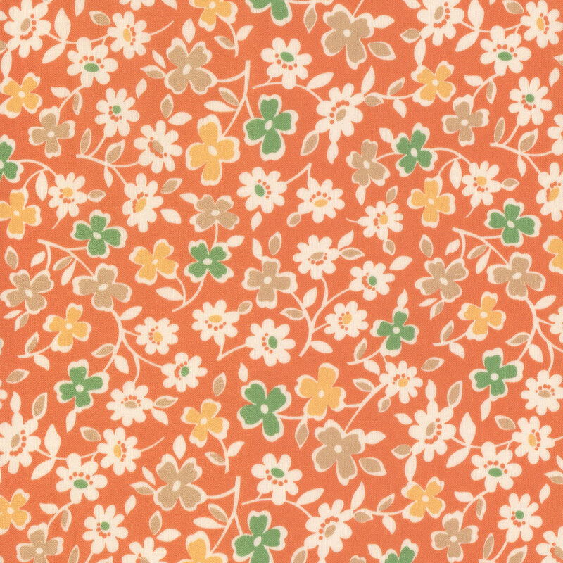 Pumpkin orange fabric with sprawling leaves and colorful flowers.