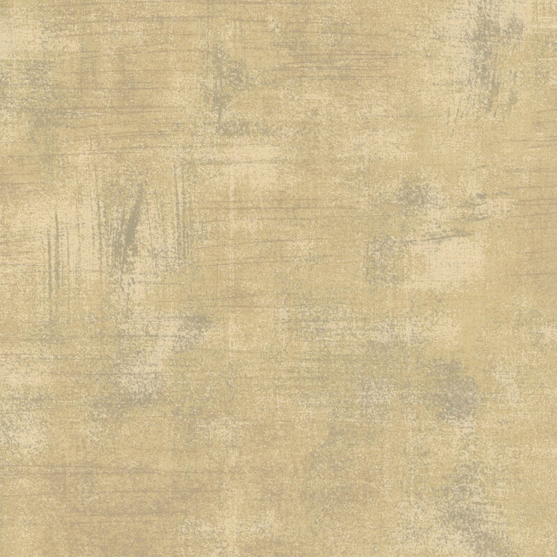 tan mottled and textured fabric